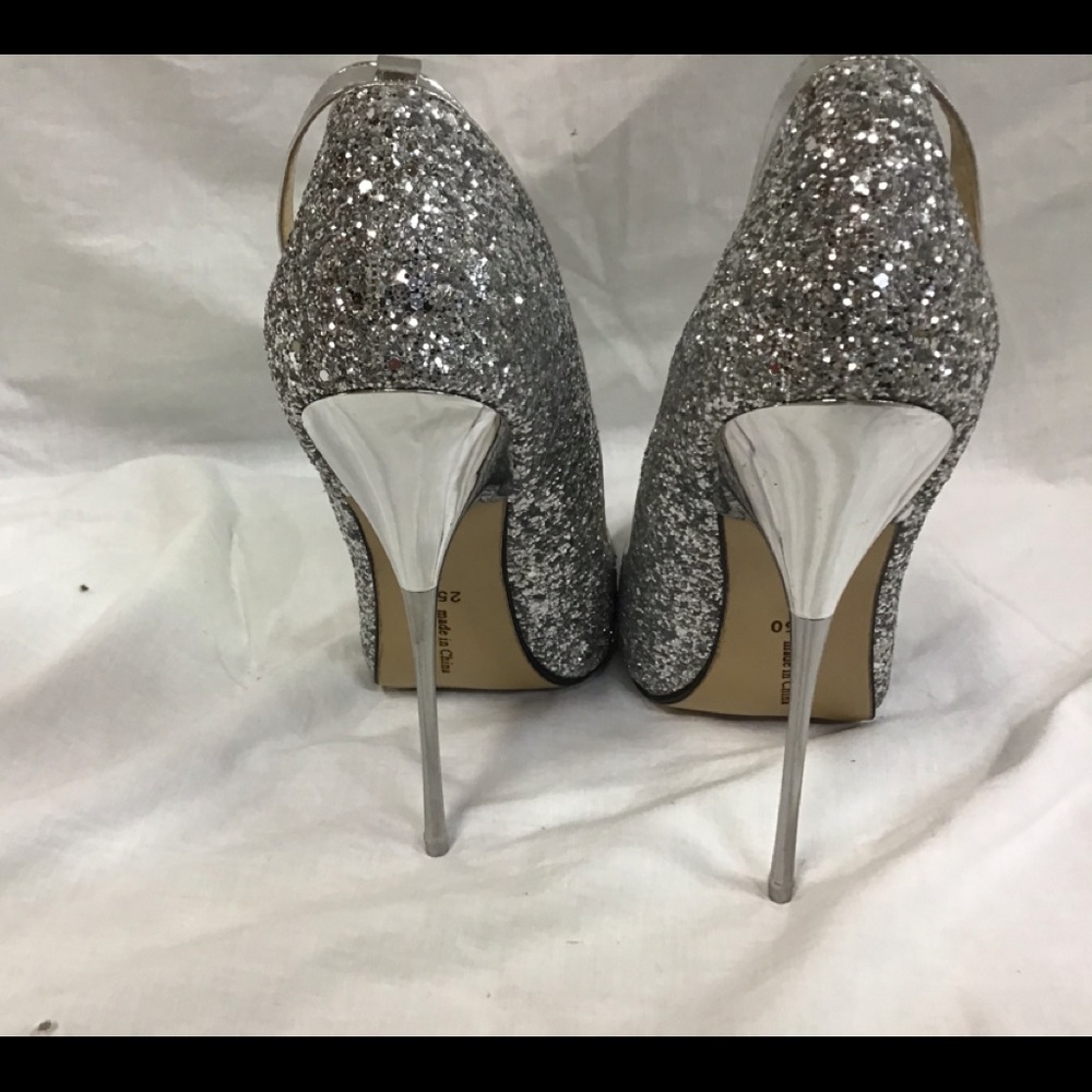 Brand new silver pumps